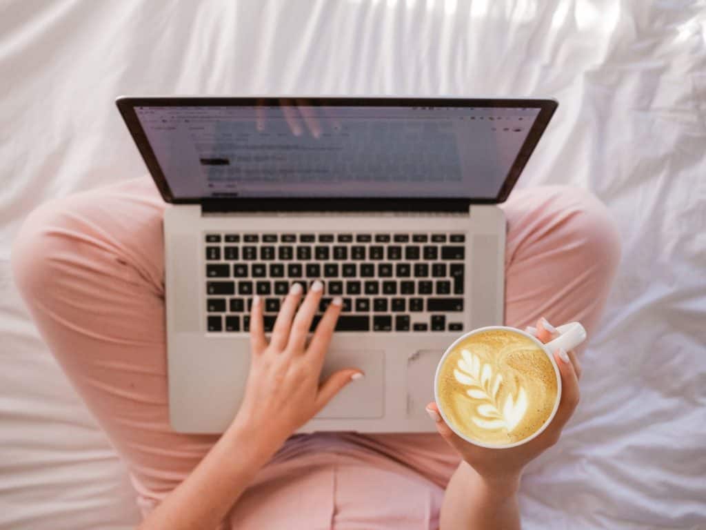woman working from home online side hustles