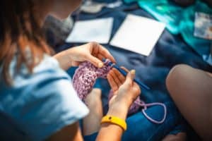 woman doing needlework make money from hobby