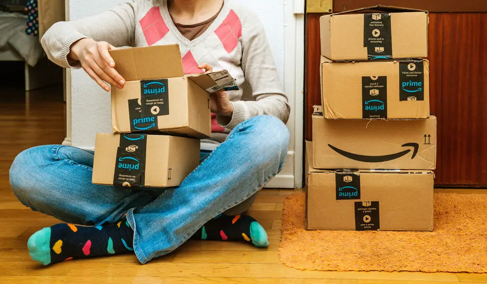 woman opening Amazon direct ship freebie package