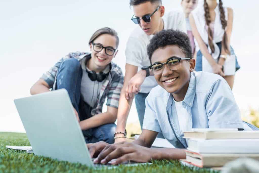 group of teens making money online