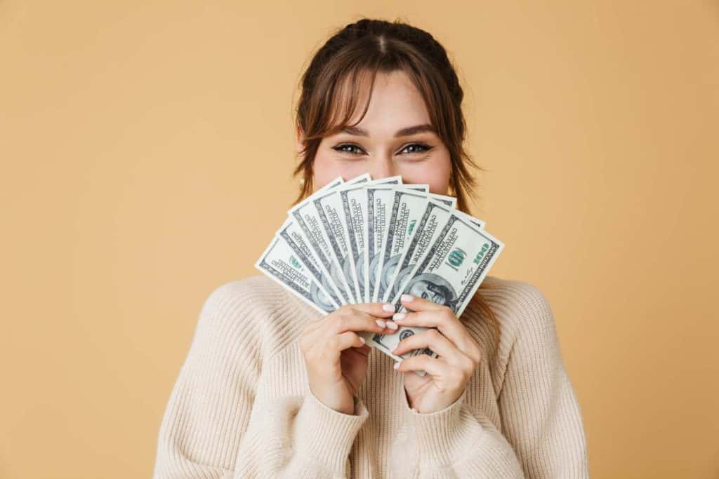 introvert woman holding money