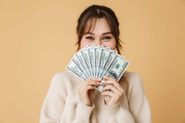 introvert woman holding money