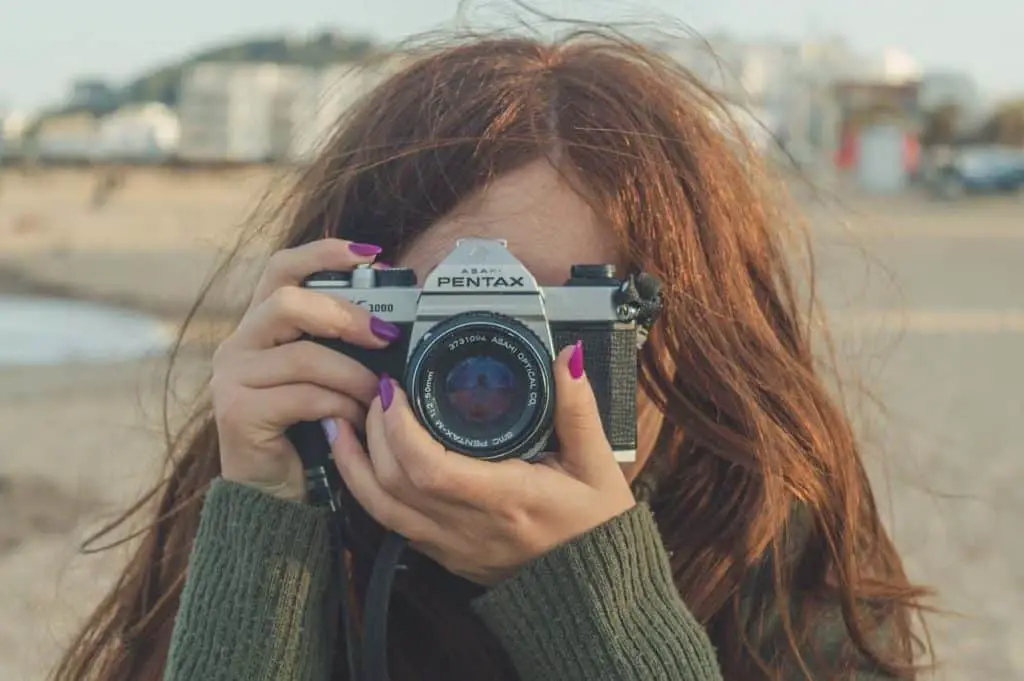 introvert woman taking photos to make money