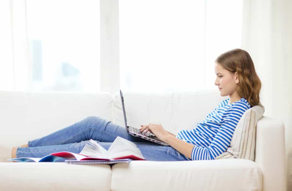 teenage girl writing to make money online