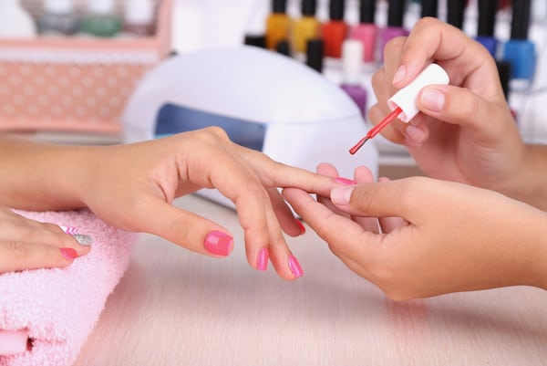woman getting manicure